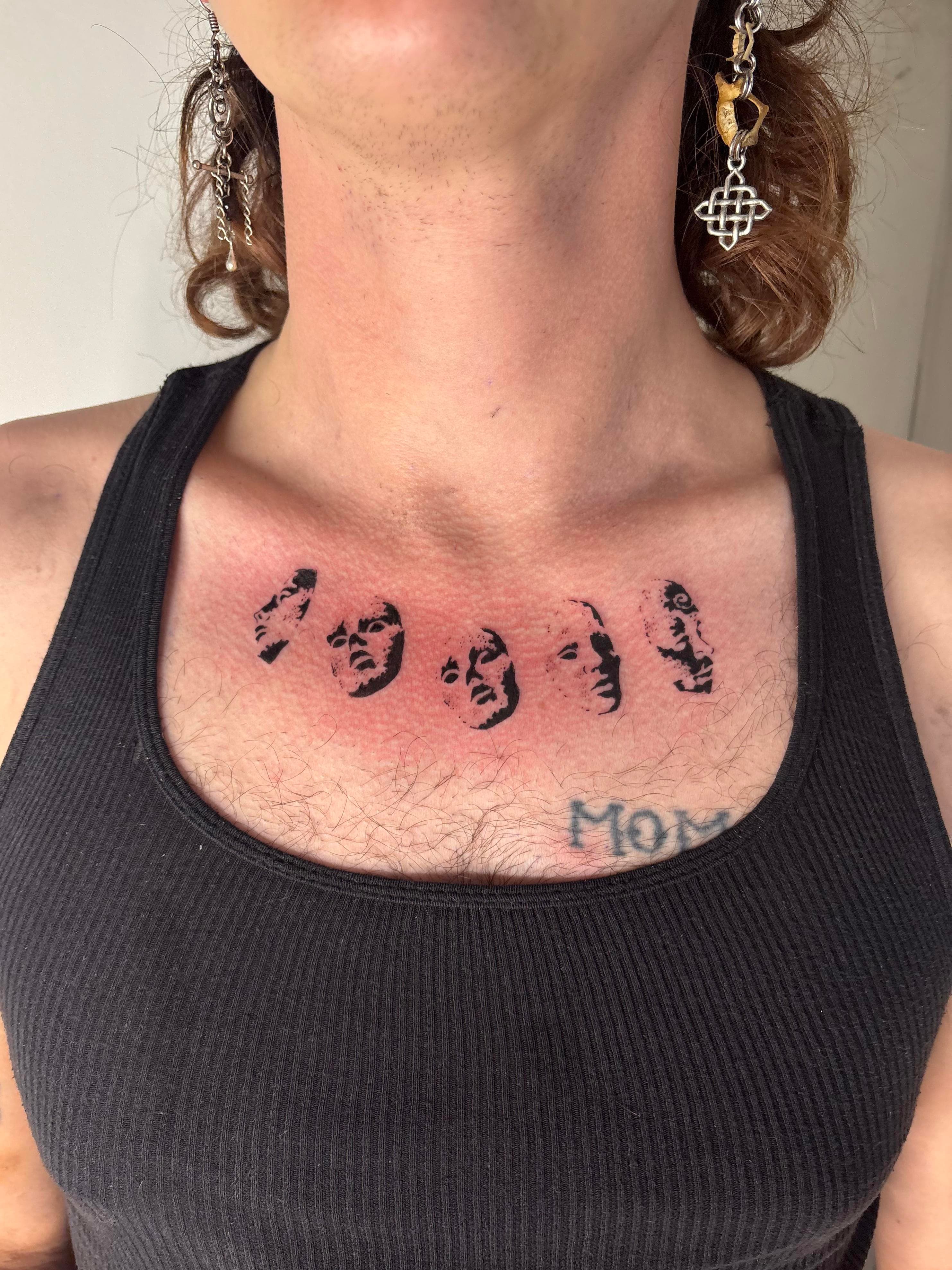 Blackwork faces tattoo