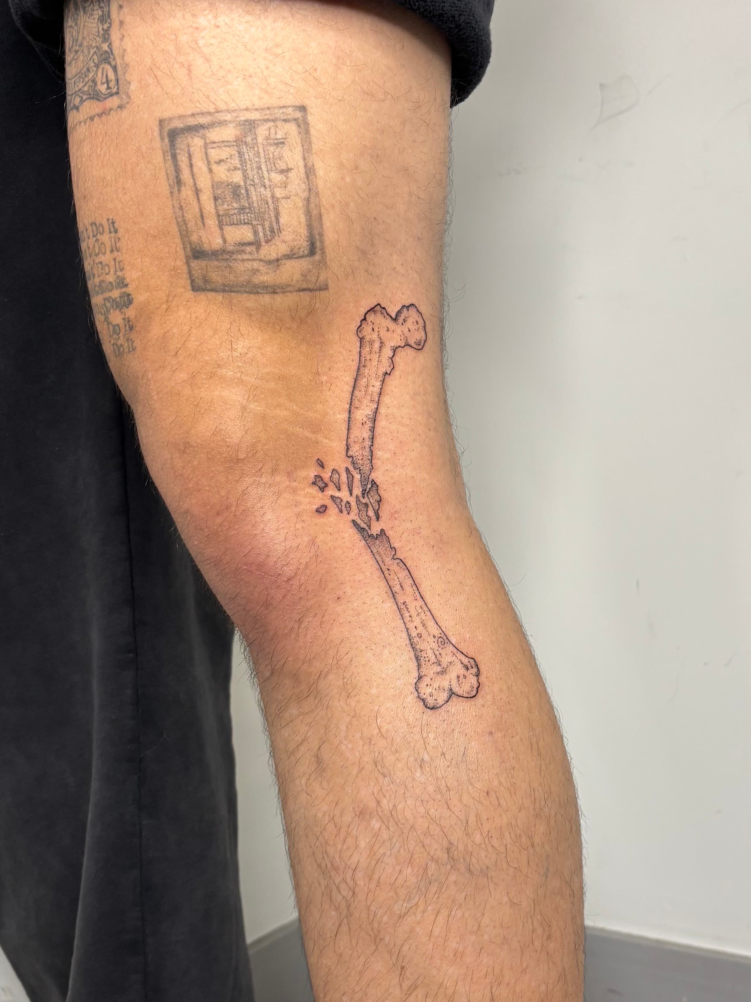 Fine line broken bone tattoo on knee